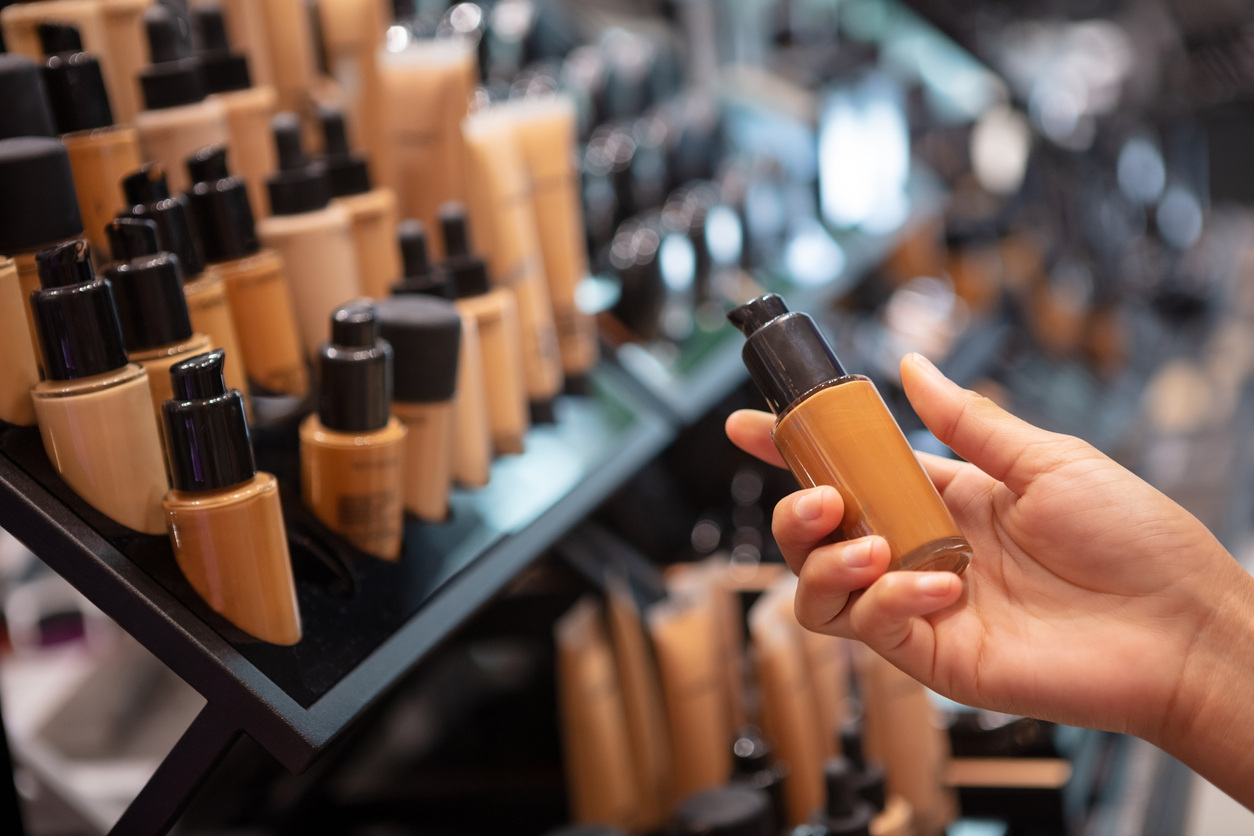 Unrecognizable woman choosing foundation